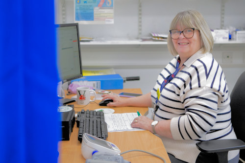 Maternity staff in front of computer